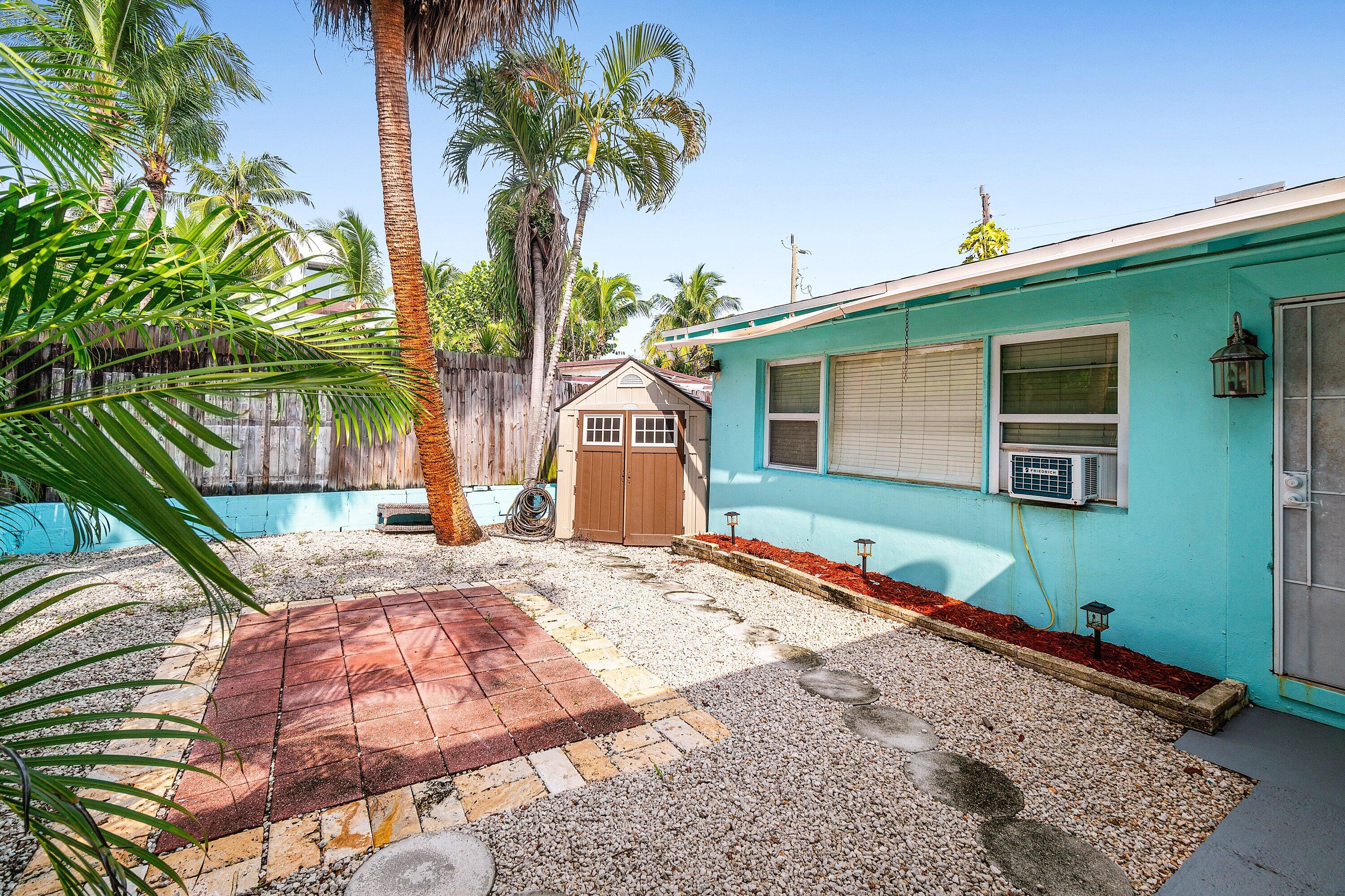 205 Coral Road, Unit 2 Boynton Beach, FL 33435 - Photo 7 of 9 a front view of a house with a yard