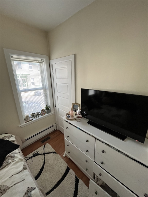 39 O Street, Unit 1 Boston, MA 02127 - Photo 12 of 26 a living room with furniture and a flat screen tv