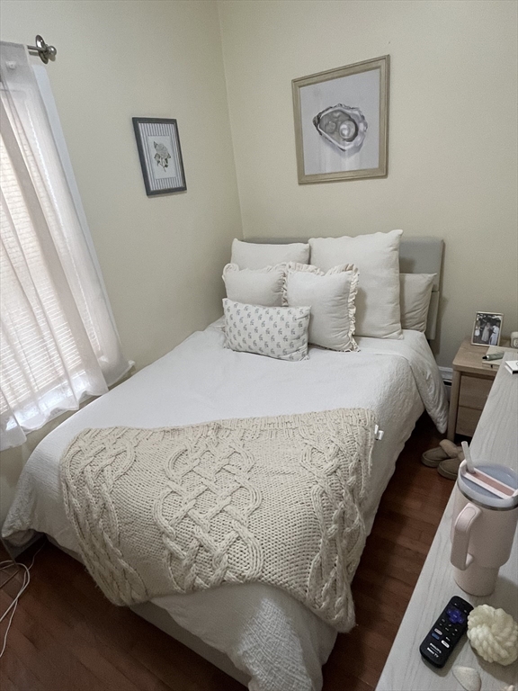 39 O Street, Unit 1 Boston, MA 02127 - Photo 13 of 26 a large bed sitting in a bedroom next to a window