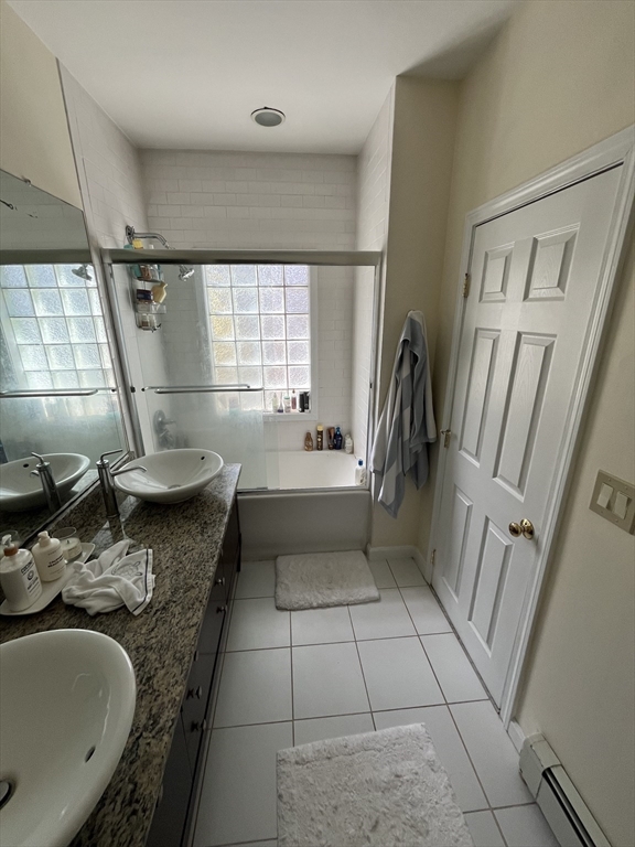 39 O Street, Unit 1 Boston, MA 02127 - Photo 20 of 26 a bathroom with a sink a toilet and a bathtub