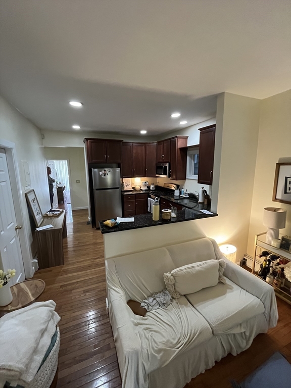 39 O Street, Unit 1 Boston, MA 02127 - Photo 3 of 26 a living room with furniture and a view of kitchen