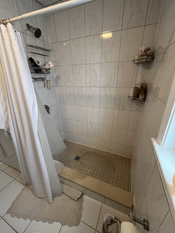 39 O Street, Unit 1 Boston, MA 02127 - Photo 10 of 26 a bathroom with a shower and a toilet