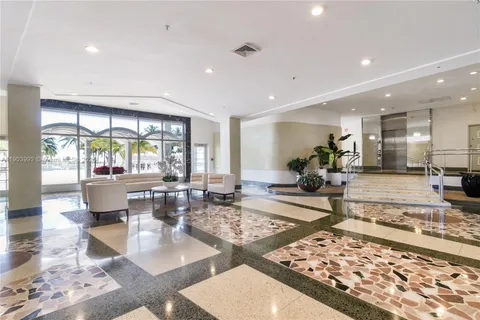 a view of a living room and kitchen view