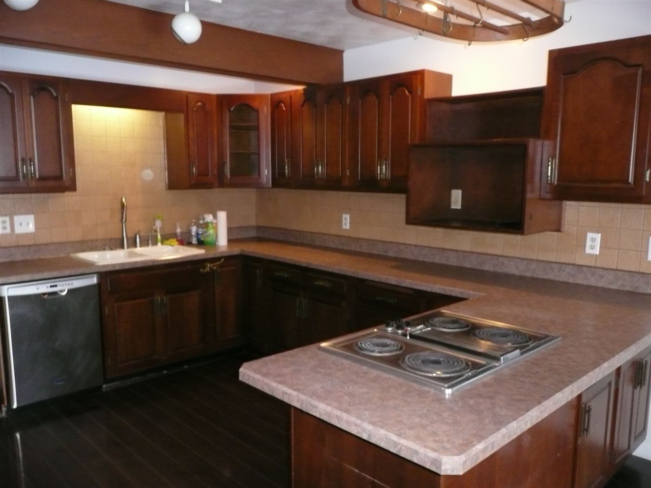 5343 Brookview Road Rockford, IL 61107 - Photo 7 of 22 a kitchen with a sink cabinets and window