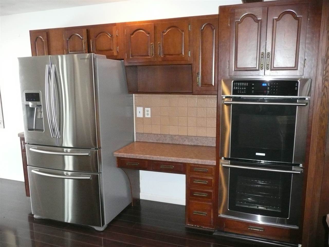 5343 Brookview Road Rockford, IL 61107 - Photo 8 of 22 a kitchen with granite countertop a refrigerator stove and cabinets