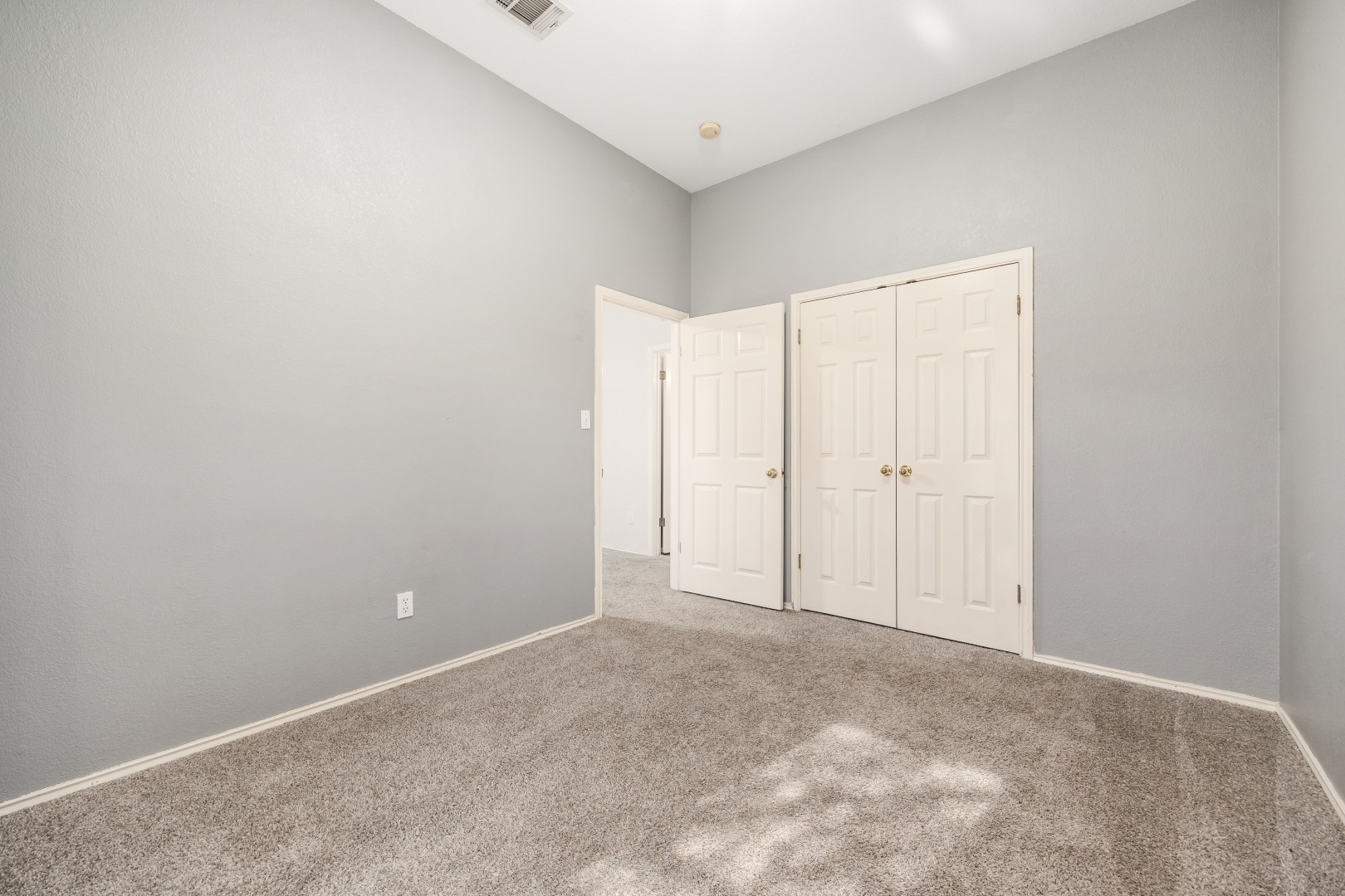 1108 Antelope Ridge Cedar Park, TX 78613 - Photo 4 of 39 High ceilings and soft carpeting create a serene and welcoming atmosphere in this bedroom.