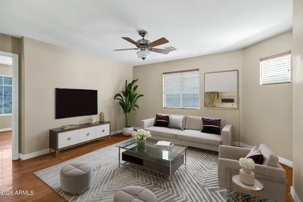 a living room with furniture and a flat screen tv