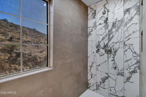 a bathroom with a bathtub and shower