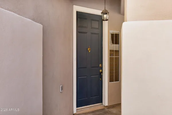 a bathroom with a shower and a door