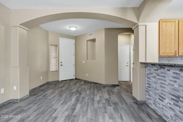 a view of hallway with wooden floor