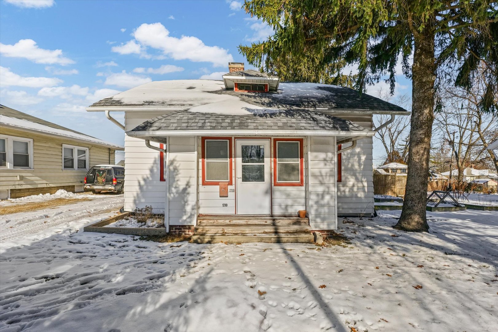 1710 West Church Street Champaign, IL 61821 - Photo 2 of 9 a front view of a house with a yard