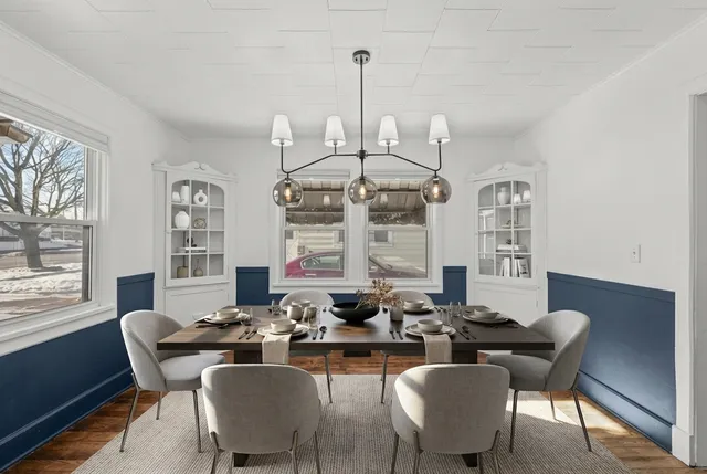 a view of a dining room with furniture window and outside view