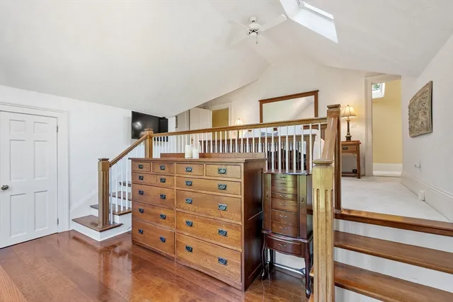 a view of bedroom with furniture and wooden floor