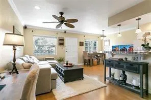 a bedroom with a bed furniture and a chandelier