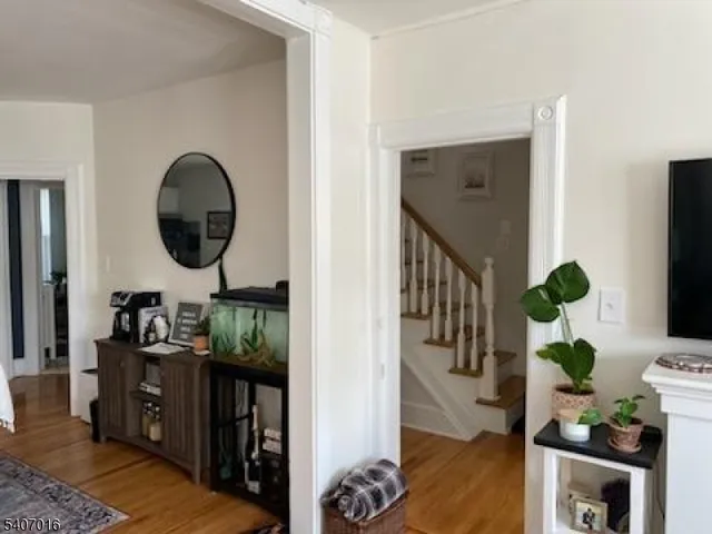 a living room with furniture and a mirror