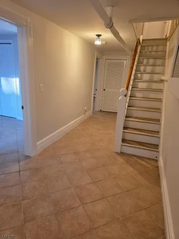 a view of a hallway with stairs