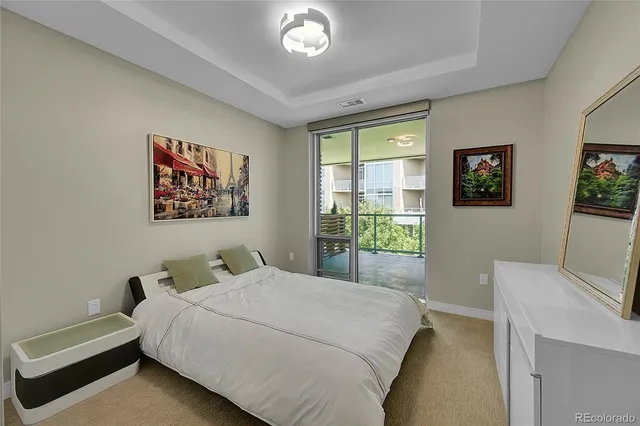 a bedroom with a bed and a desk