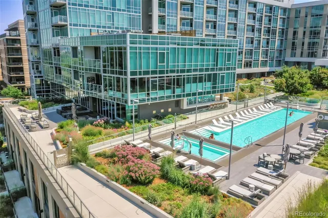 a view of swimming pool with outdoor seating