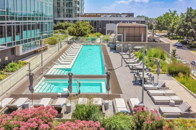 a view of a chairs and table in the backyard