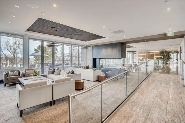 a large room with lots of furniture and a large window