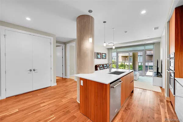 a large kitchen with a table and chairs