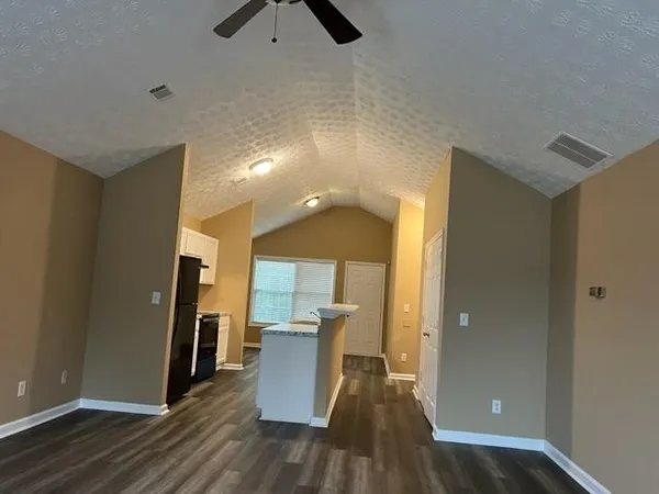 a view of a kitchen from the hallway