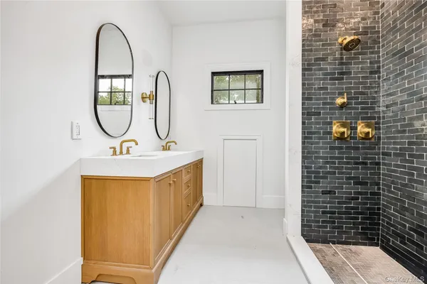 a bathroom with a sink a toilet and a shower