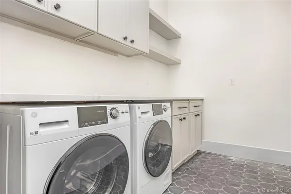 a utility room with dryer and washer