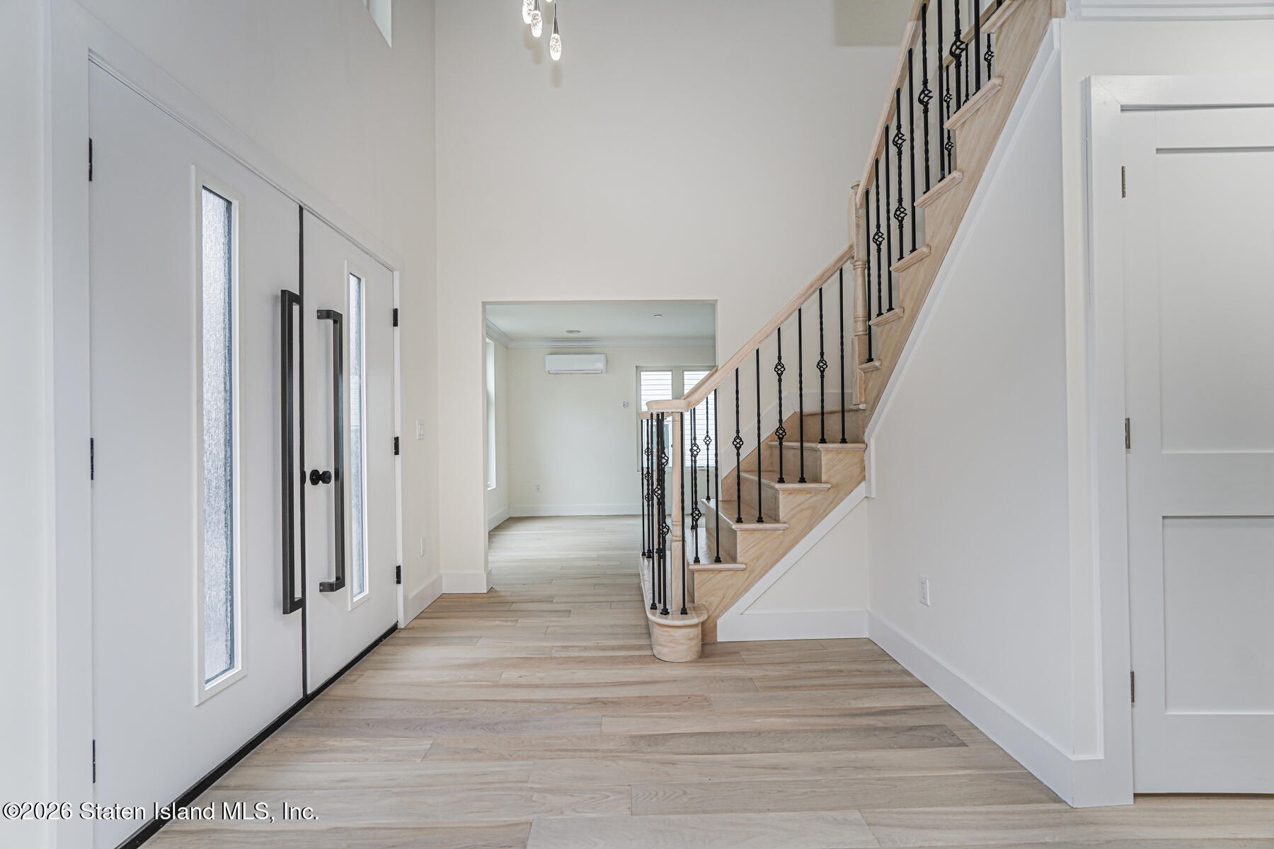54 Cedarcliff Road Staten Island, NY 10301 - Photo 5 of 49 a view of a hallway with wooden floor and entryway
