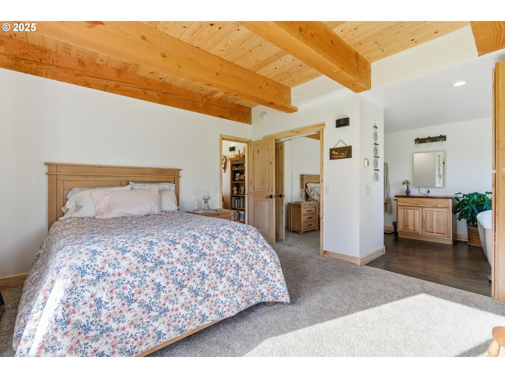 314 East Valley Road Skamokawa, WA 98647 - Photo 11 of 46 a bedroom with a bed and a view of living room