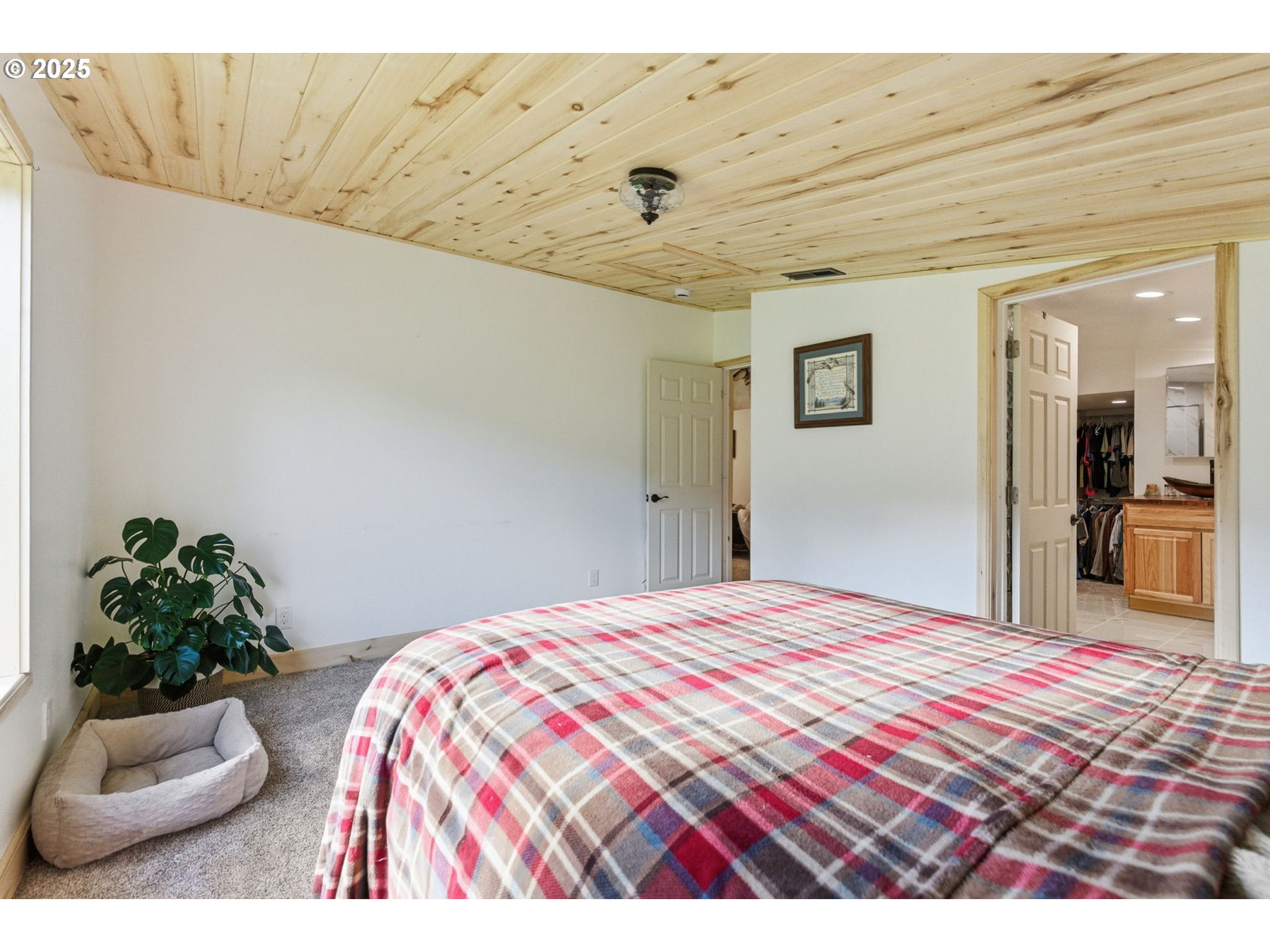 314 East Valley Road Skamokawa, WA 98647 - Photo 17 of 46 a bedroom with a bed and a couch