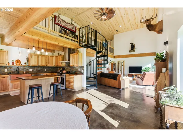 a view of a living room and kitchen with furniture