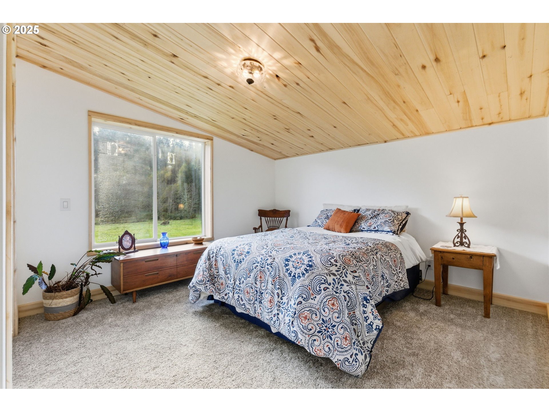 314 East Valley Road Skamokawa, WA 98647 - Photo 23 of 46 a bedroom with bed and window
