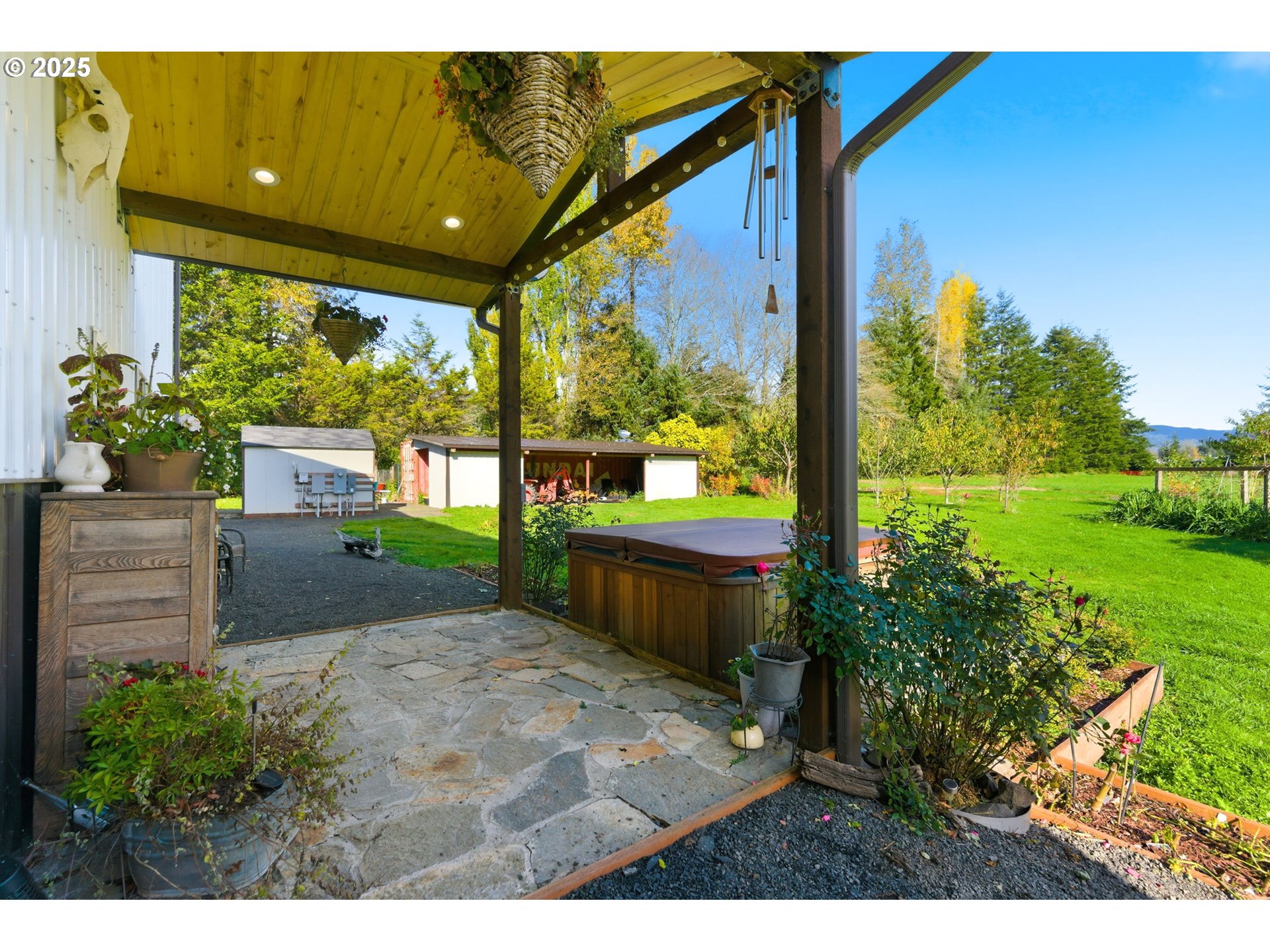 314 East Valley Road Skamokawa, WA 98647 - Photo 29 of 46 a backyard of a house with a garden and outdoor seating