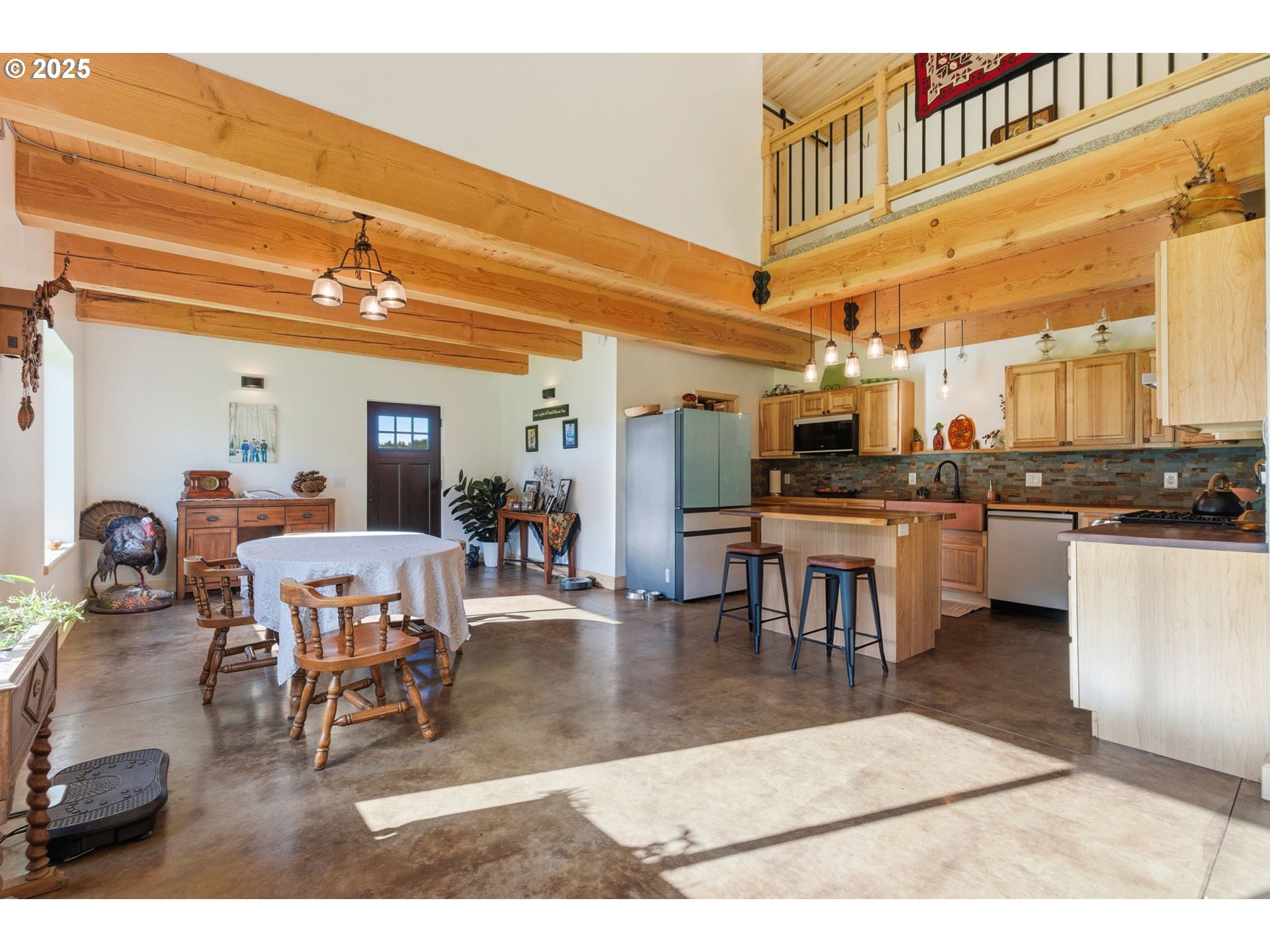 314 East Valley Road Skamokawa, WA 98647 - Photo 7 of 46 a living room with lots of furniture and kitchen view