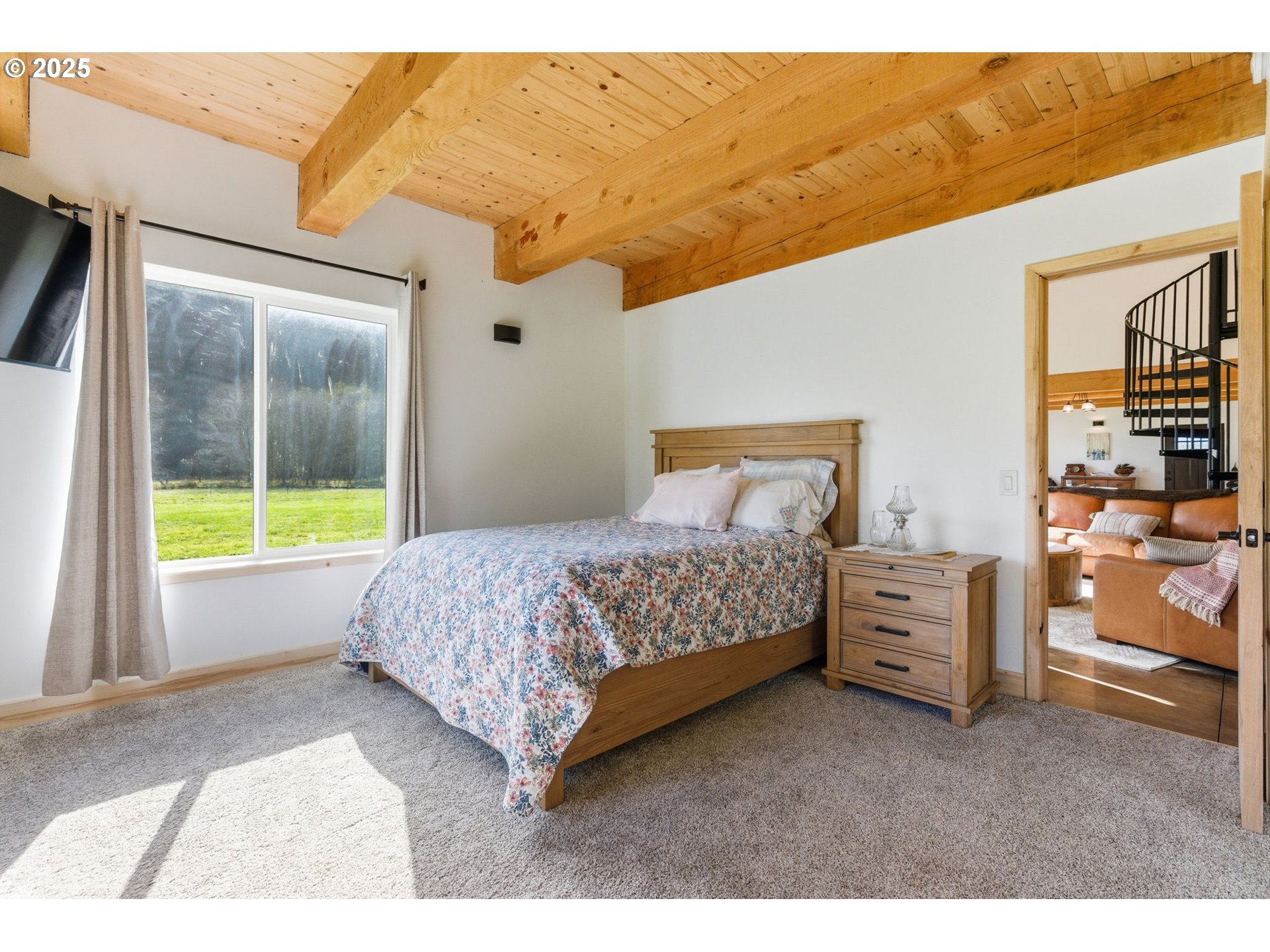 314 East Valley Road Skamokawa, WA 98647 - Photo 10 of 46 a bedroom with a bed and a window