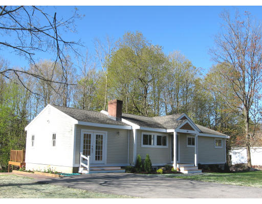 144 Potter Road Framingham, MA 01701 - Photo 1 of 1 a front view of a house with a yard and garage
