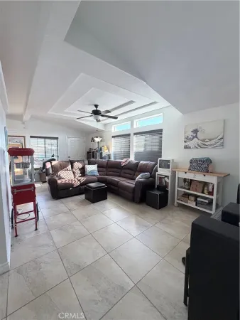 a living room with a couch and a wooden floor
