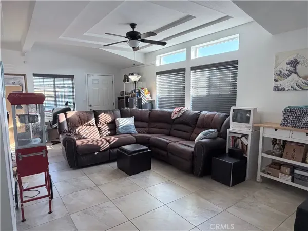 a living room with furniture and a window