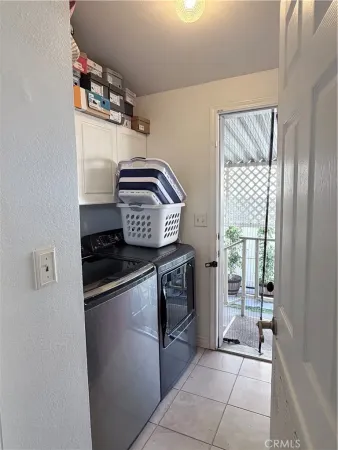 a kitchen with stainless steel appliances granite countertop a stove and a refrigerator