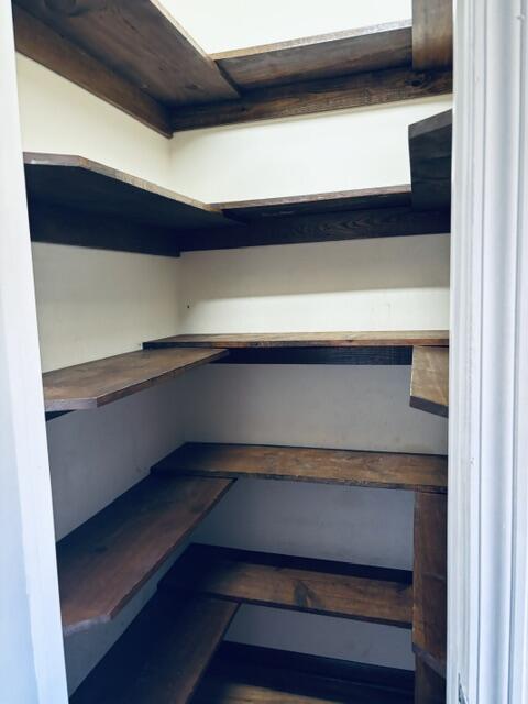 402 Juniper Street Destin, FL 32541 - Photo 8 of 20 a hallway with a wooden floor