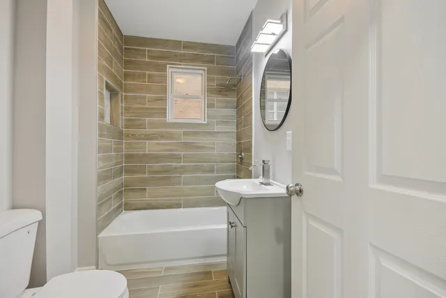 a bathroom with a toilet sink and bathtub