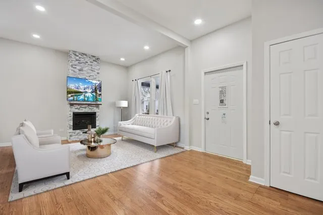 a living room with furniture and a fireplace