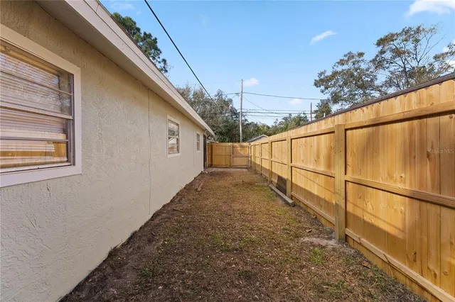 a view of a backyard of the house