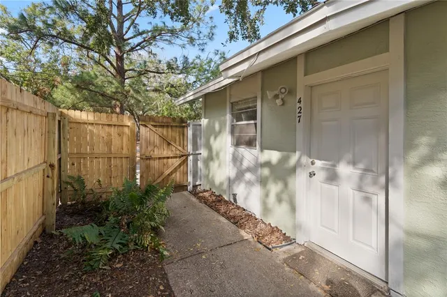 an aerial view of a houses with city view