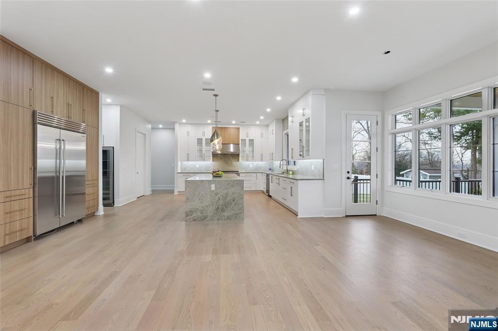 311 North Farview Avenue Paramus, NJ 07652 - Photo 13 of 50 a view of a kitchen with refrigerator and wooden floor