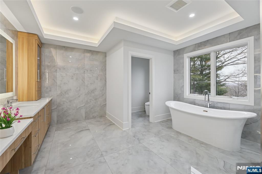 311 North Farview Avenue Paramus, NJ 07652 - Photo 25 of 50 a bathroom with a bathtub and shower