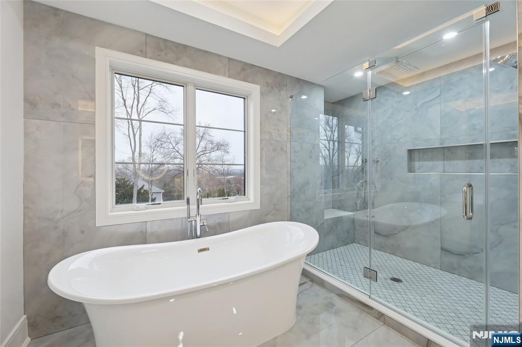 311 North Farview Avenue Paramus, NJ 07652 - Photo 27 of 50 a white bath tub sitting next to a shower