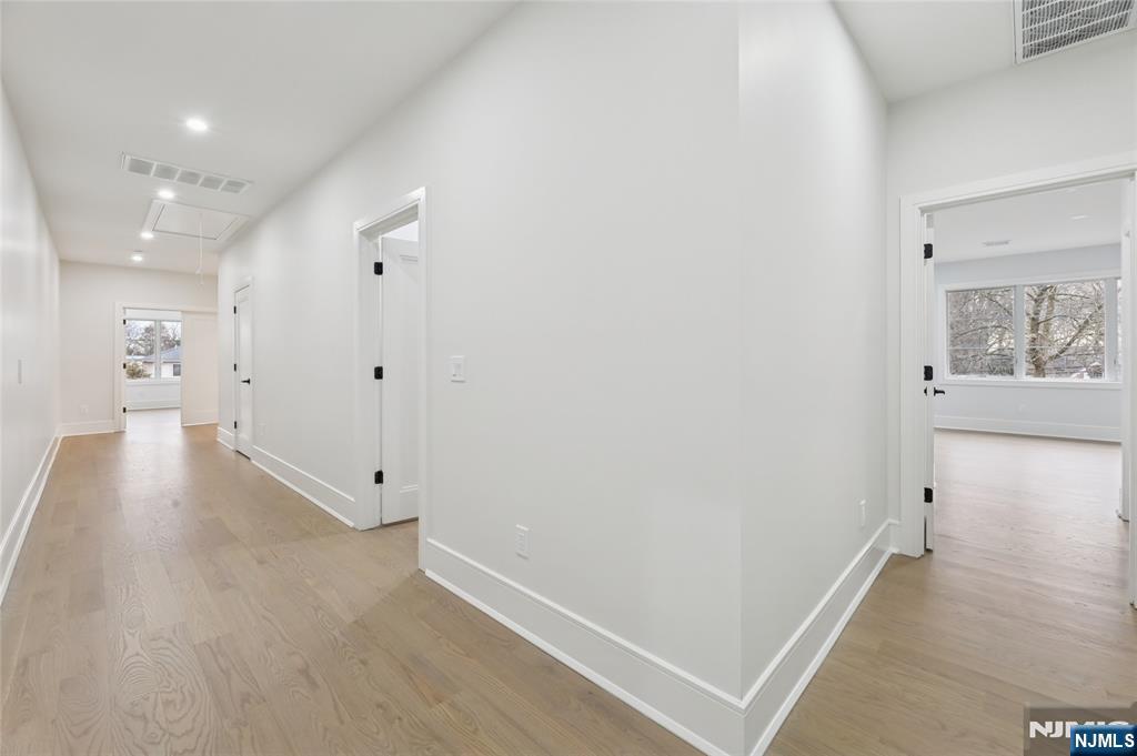 311 North Farview Avenue Paramus, NJ 07652 - Photo 32 of 50 a view of a hallway with wooden floor