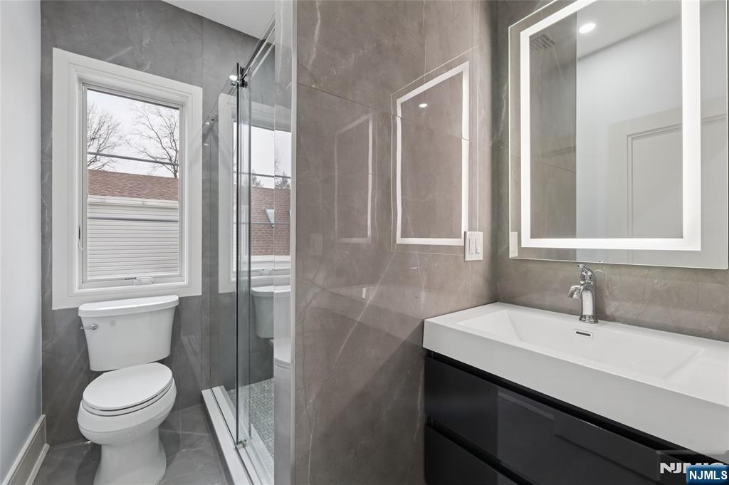 311 North Farview Avenue Paramus, NJ 07652 - Photo 38 of 50 a bathroom with a sink and a toilet